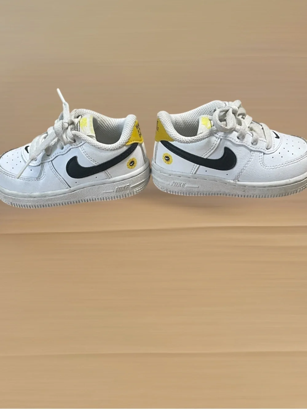 Nike Toddler White Sneakers with Black Swoosh and Yellow Star